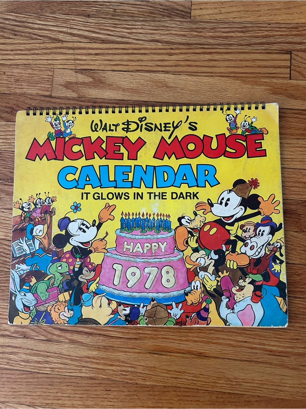Disney Mickey Mouse Yellow Calendar with Pink Cake and Blue Title Accents